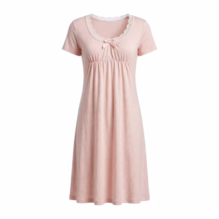 Ladies nightdress in blush pink cotton jersey, full front view with a lace-trim scoop neckline, small satin bow, short sleeves and soft gathers under the bust