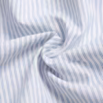 Close-up of the white cotton poplin of the boxer shorts, showing the fine plain weave and the light blue pinstripes