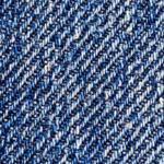 Close-up of the indigo denim weave of the men's trousers, showing the diagonal twill lines and the white weft yarns between the indigo warp