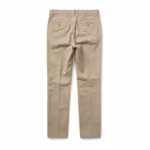 Men's dress trousers in stone beige cotton twill, back view with yoke, two buttoned welt back pockets, belt loops and pressed back creases - same pair as the front view