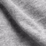 Close-up of the grey marl cotton single jersey of the undergarments, showing the fine knit loops and heathered yarn texture