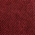 Close-up of burgundy cotton pique knit showing the raised pique cells, yarns and fine fibres of the polo fabric