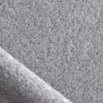 Close-up of grey marl anti-pill microfleece showing the dense brushed pile and the heathered fibre mix across a soft diagonal fold