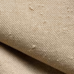 Close-up of the khaki cotton duck canvas plain weave with natural fibre slubs on the canvas work shirt